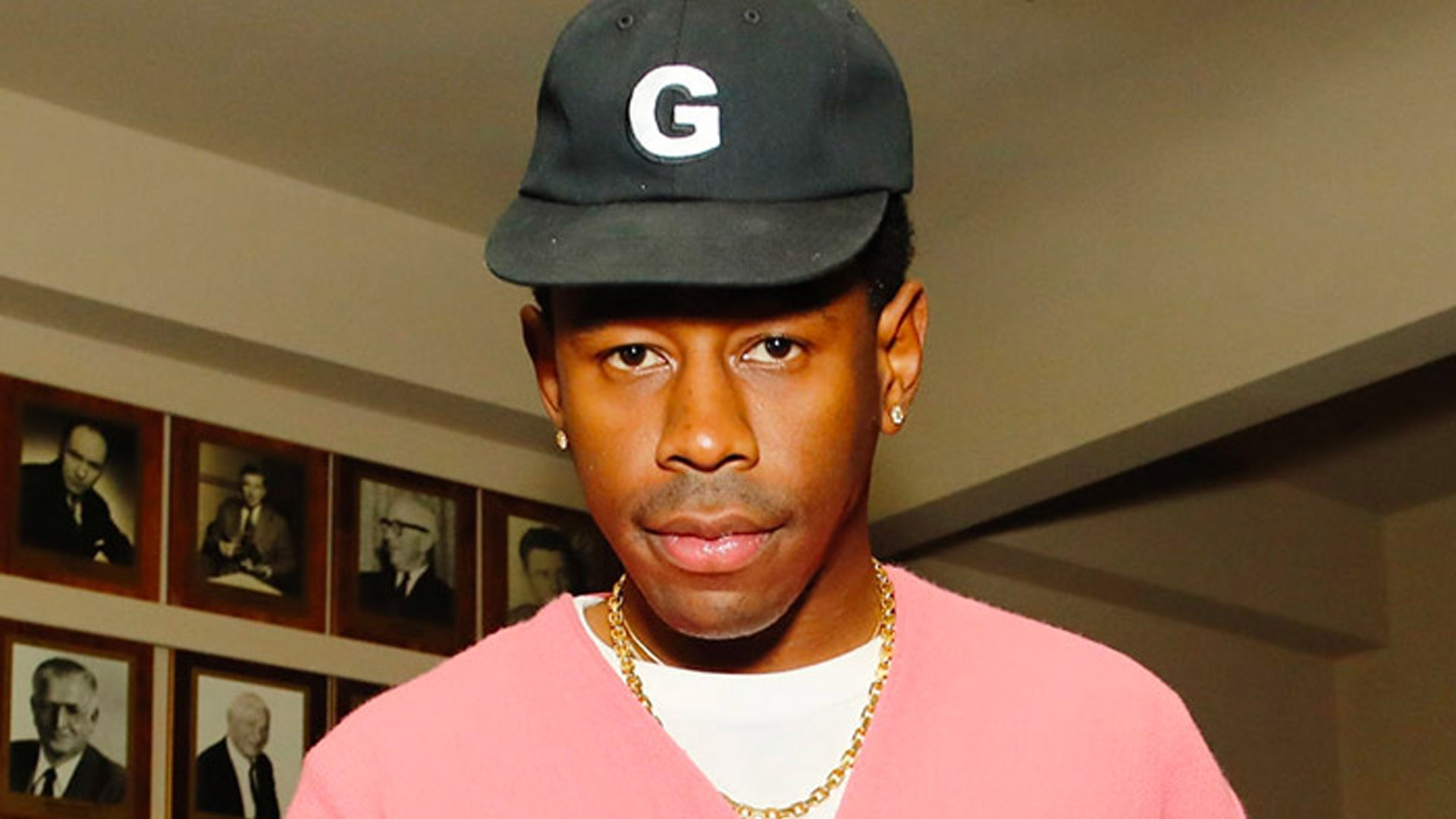 Tyler The Creator Is Wearing Pink White Dress And Gold Chain On Neck And Black Cap 2K Tyler The Creator