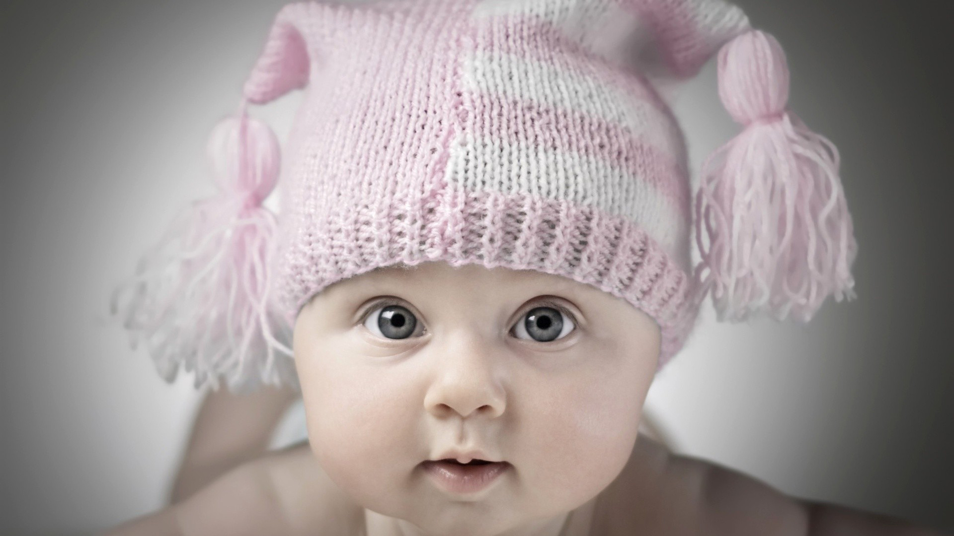 Cute Baby Is Wearing White Pink Woolen Knitted Cap 2K Cute