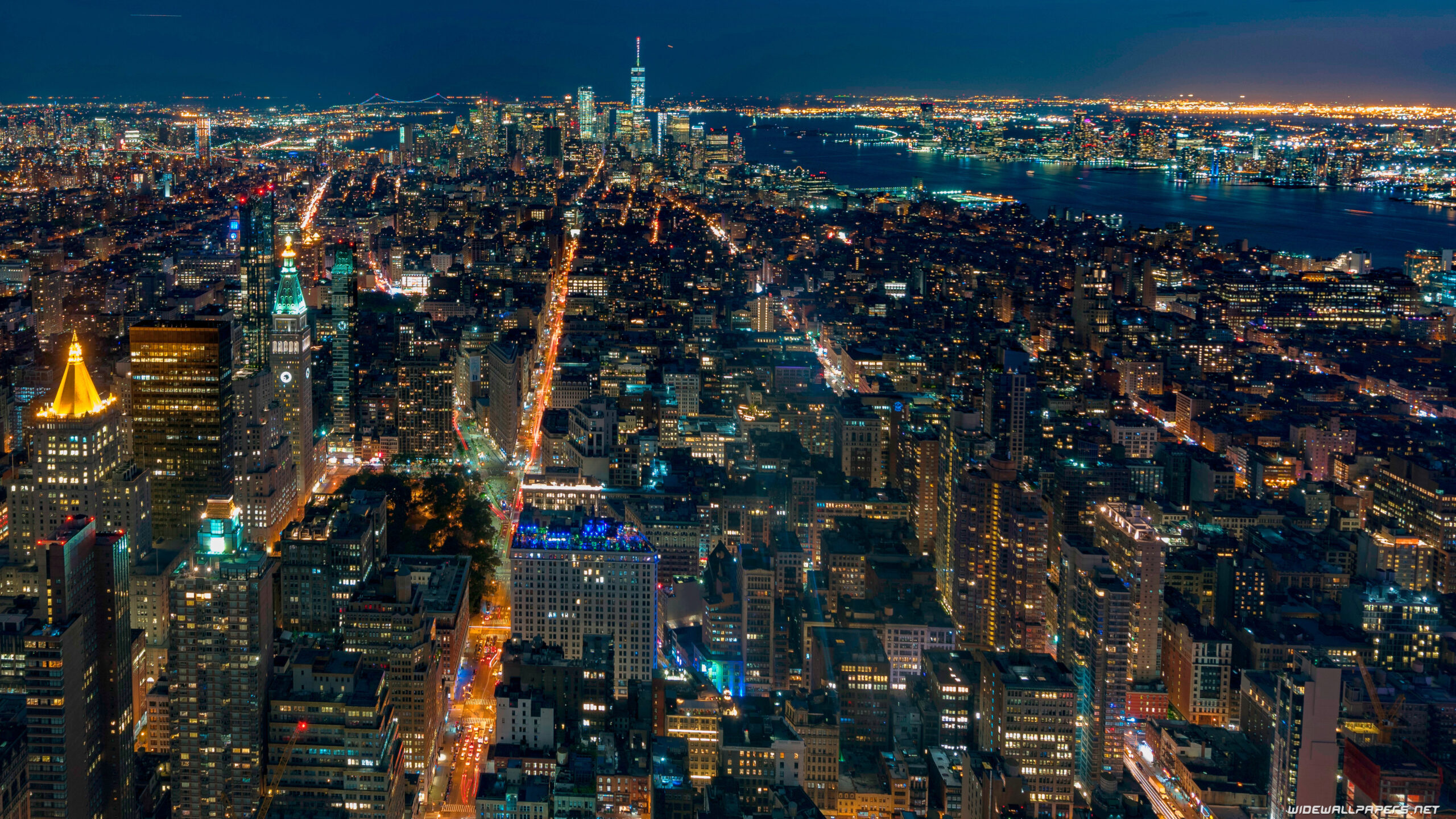 Aerial View Of New York City With Shimmering Lights During Nighttime K 2K Travel