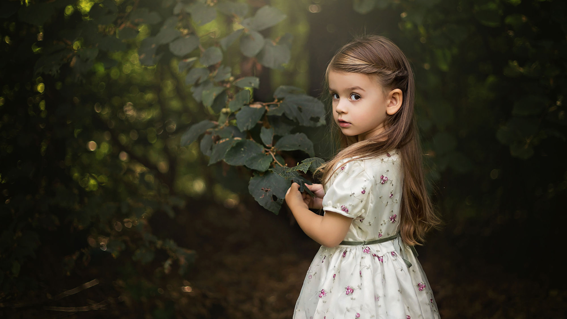 Nice Girl Child With White Dress Is Touching Leaf 2K Cute