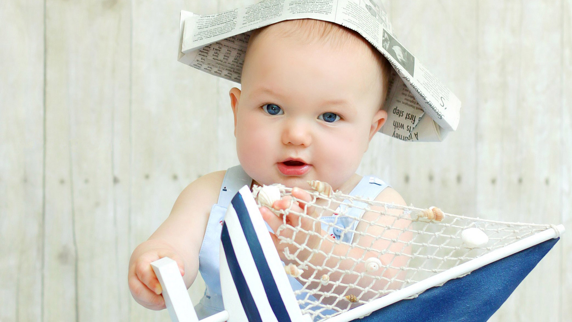 Blue Eyes Cute Baby Child Is Wearing Light Blue Dress Standing In Blur White Wallpaper 2K Cute
