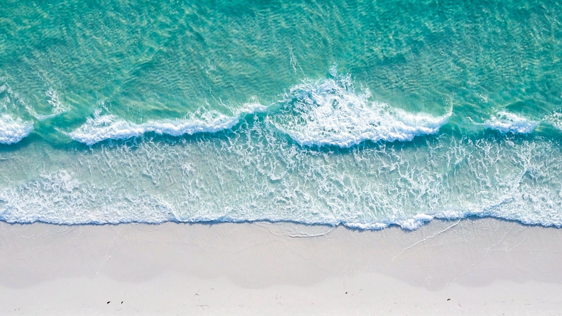 Aerial View Of Ocean Foam Waves Coast White Beach Sand 2K Ocean