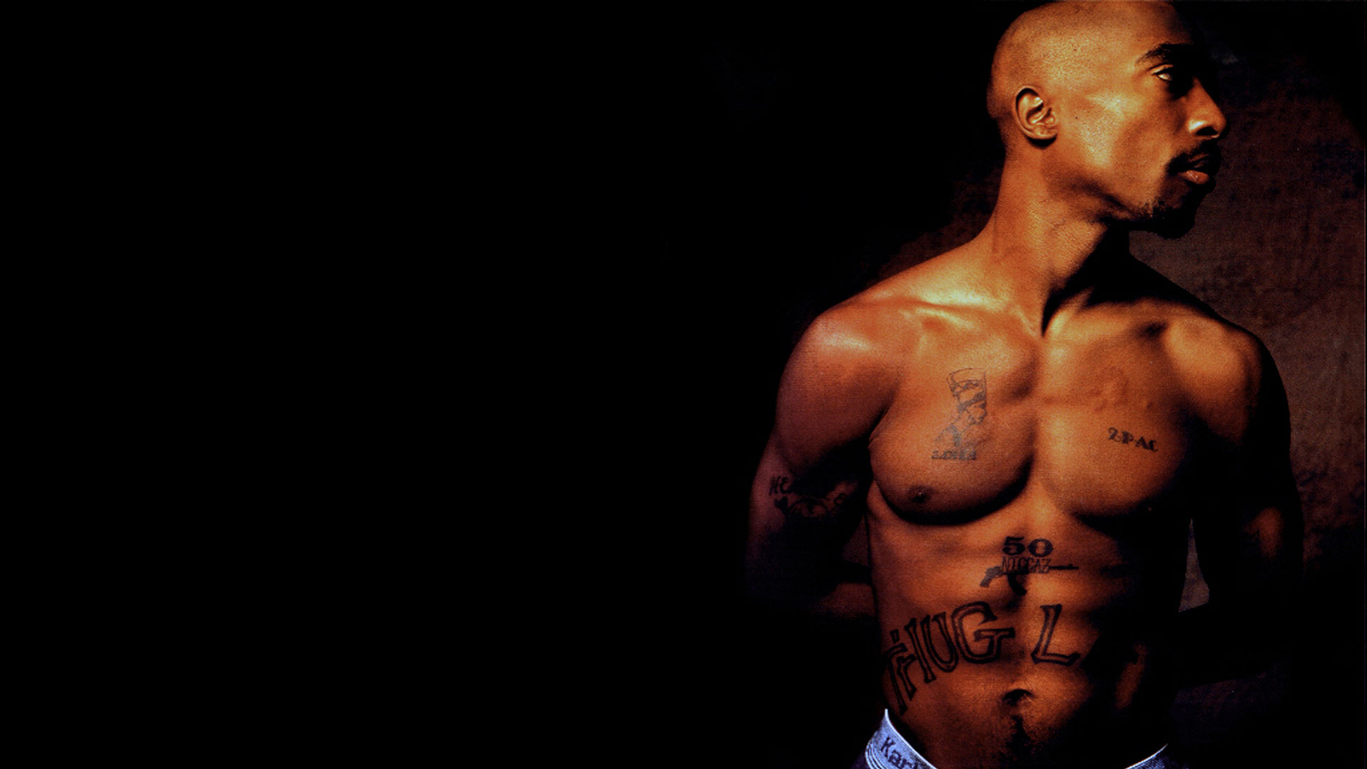 Pac Tupac Is Having Tattoos On Chest And Abdomen Facing One Side 2K Music
