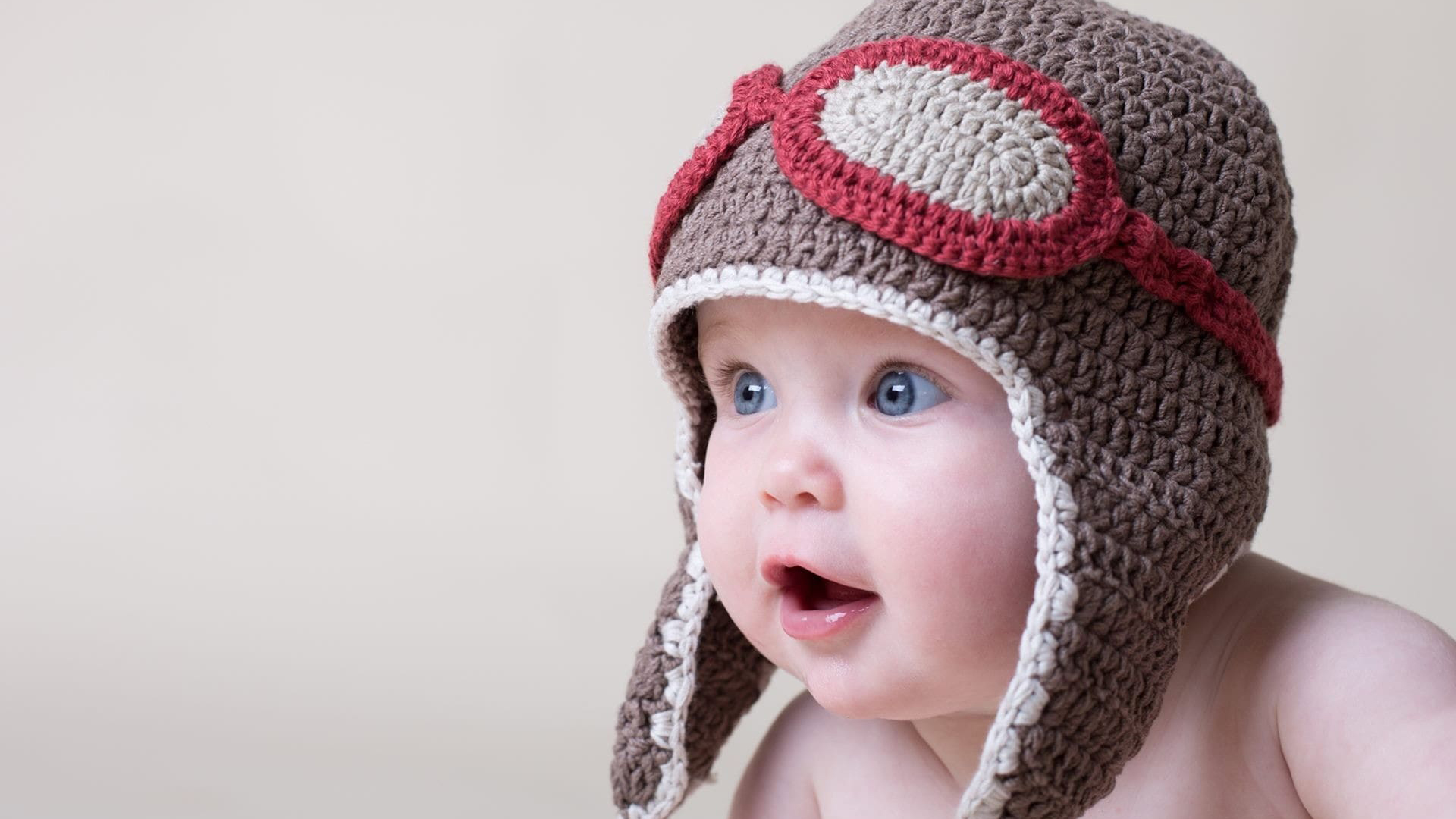 Beautiful Grey Eyes Cute Baby Child With Brown Woolen Knitted Cap 2K Cute