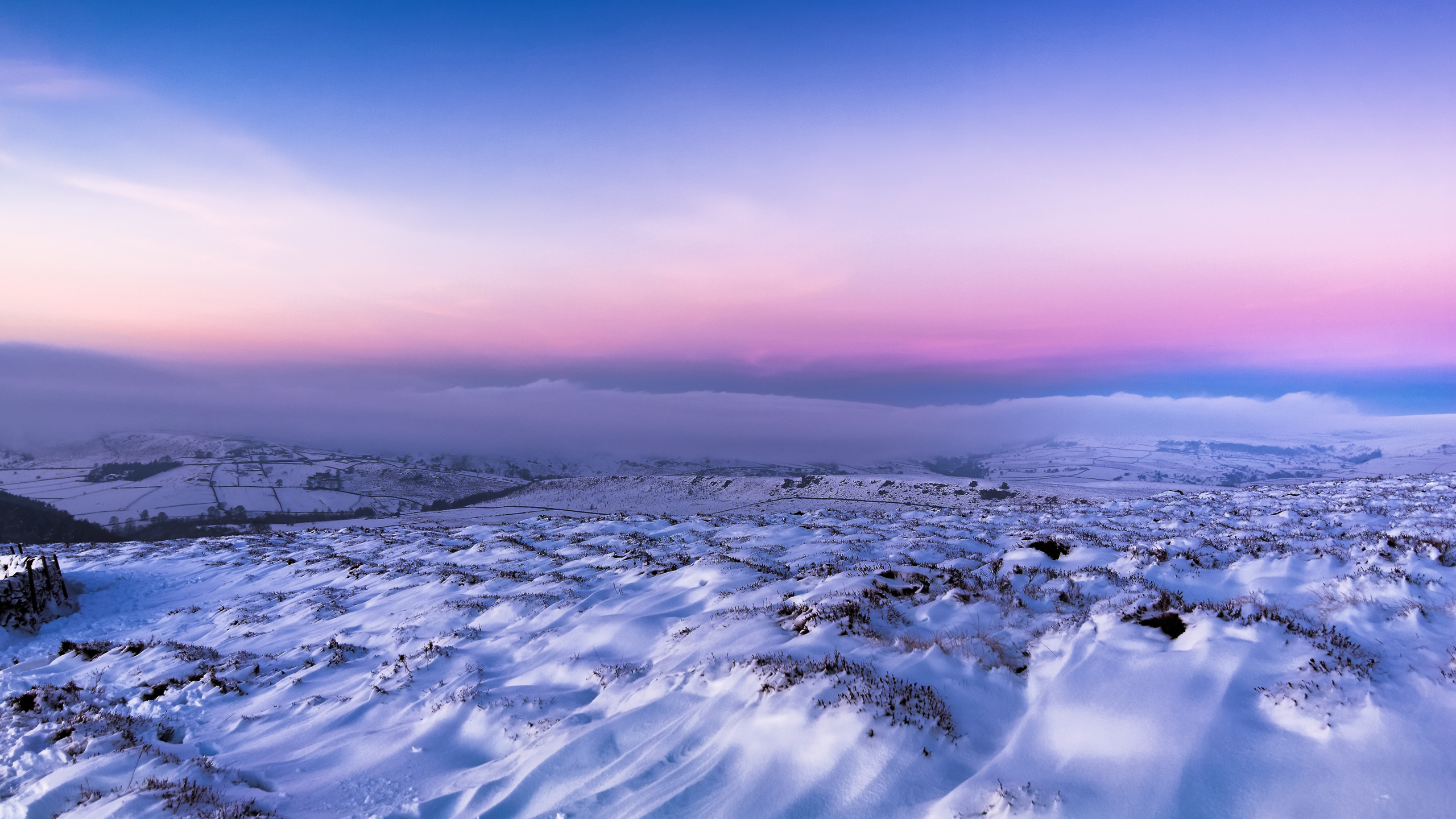 Frozen Snow Covered Rocks Mountains Under Light Pink Blue Clouds Sky 2K Nature