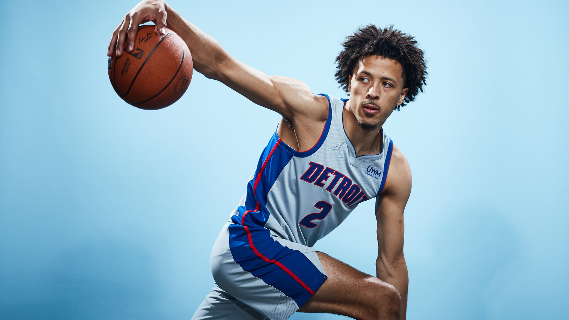 Cade Cunningham With Basketball In Blue Wallpaper 2K Sports