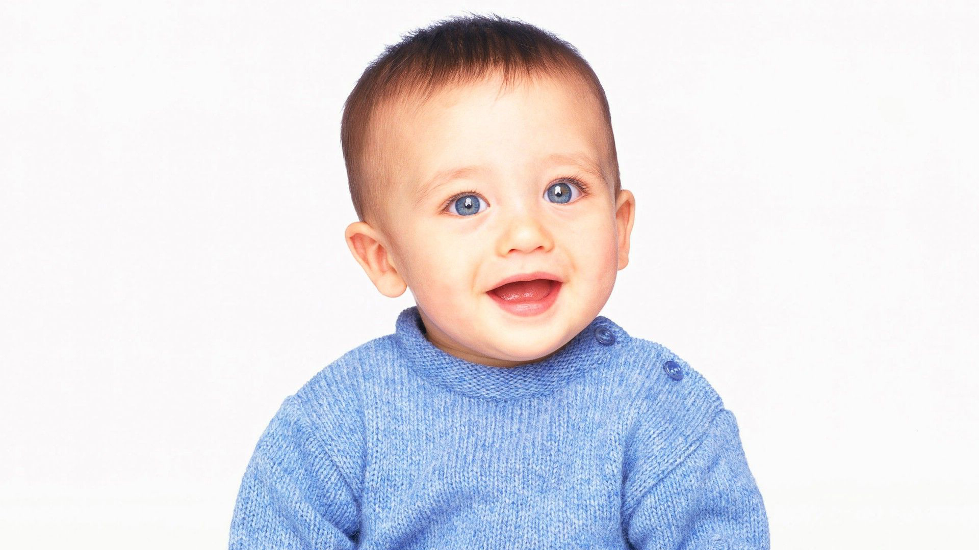 Grey Eyes Cute Baby Boy Child Is Wearing Blue Woolen Knitted Dress Sitting In White Wallpaper 2K Cute