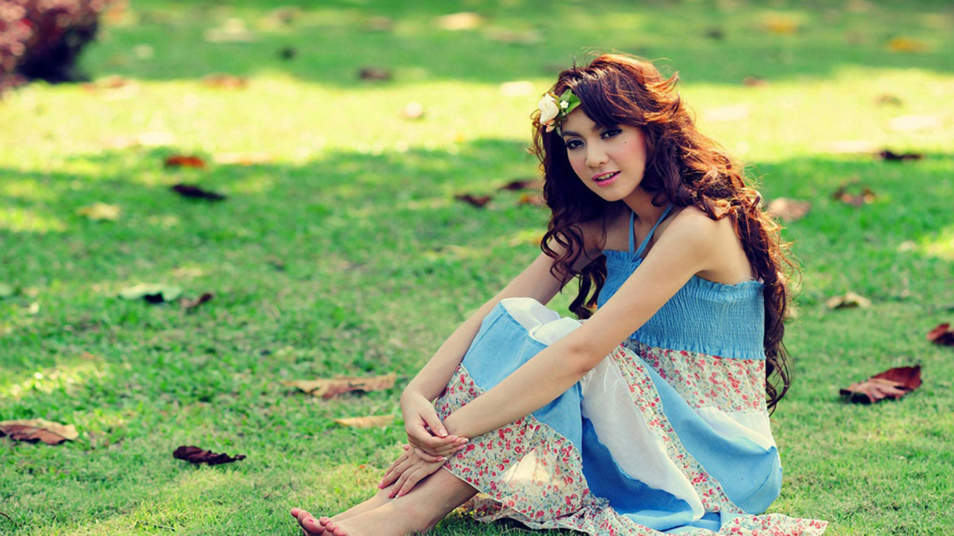 Stunning Girl Model Is Sitting On Green Grass Wearing Blue White Dress 2K Girls