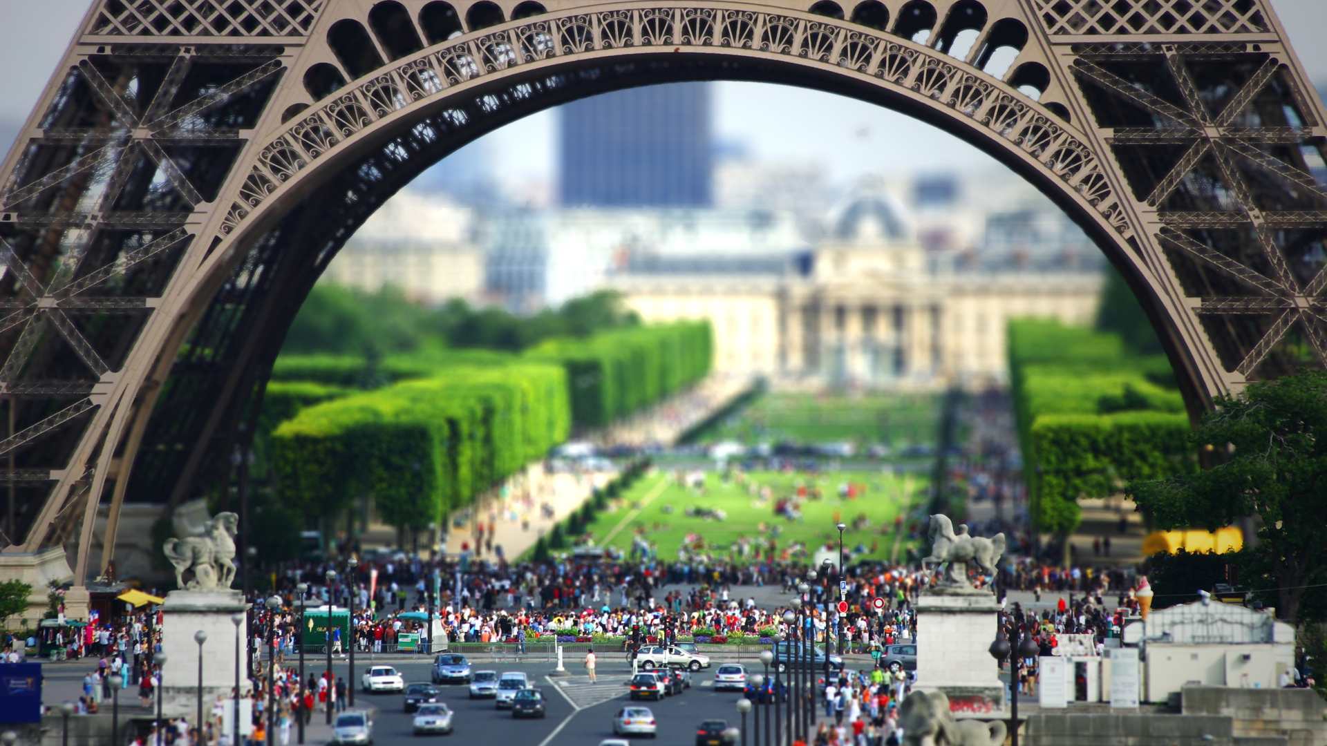 Immensity Of Torre Eiffel Tower With Cars On Road And Shallow Wallpaper Of Green Field And People 2K Travel