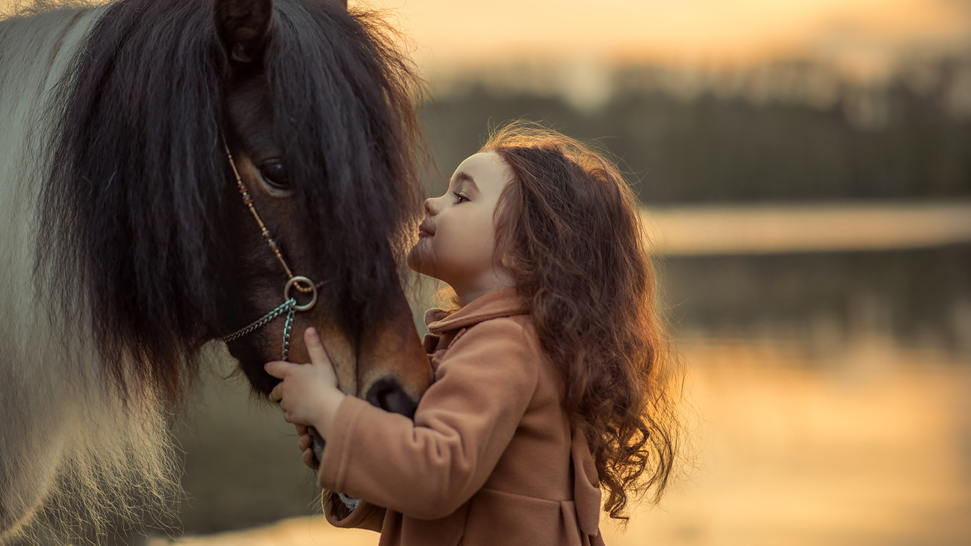 Cute Little Girl Is Playing With Horse Wearing Brown Dress In Blur Wallpaper 2K Cute