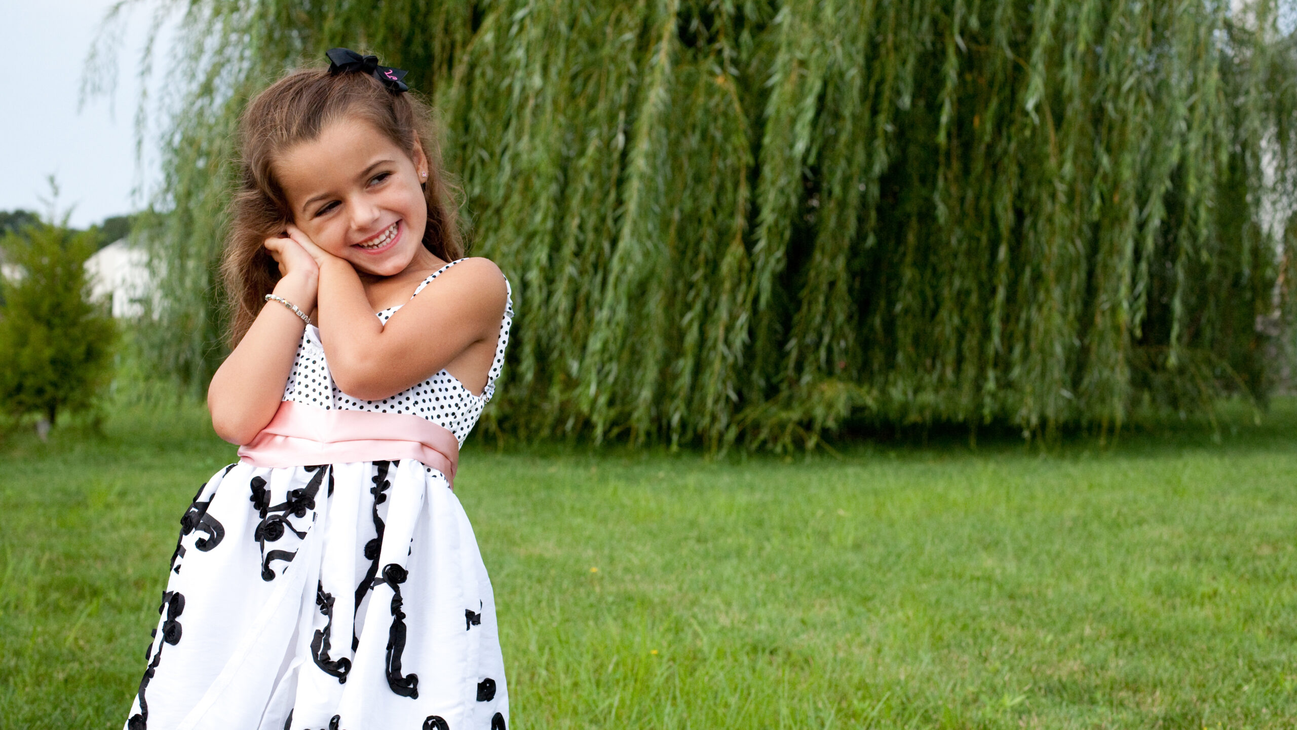Beautiful Smiley Cute Little Girl Is Standing In Green Plants Grass Field Wallpaper Wearing Black White Dress K 2K Cute