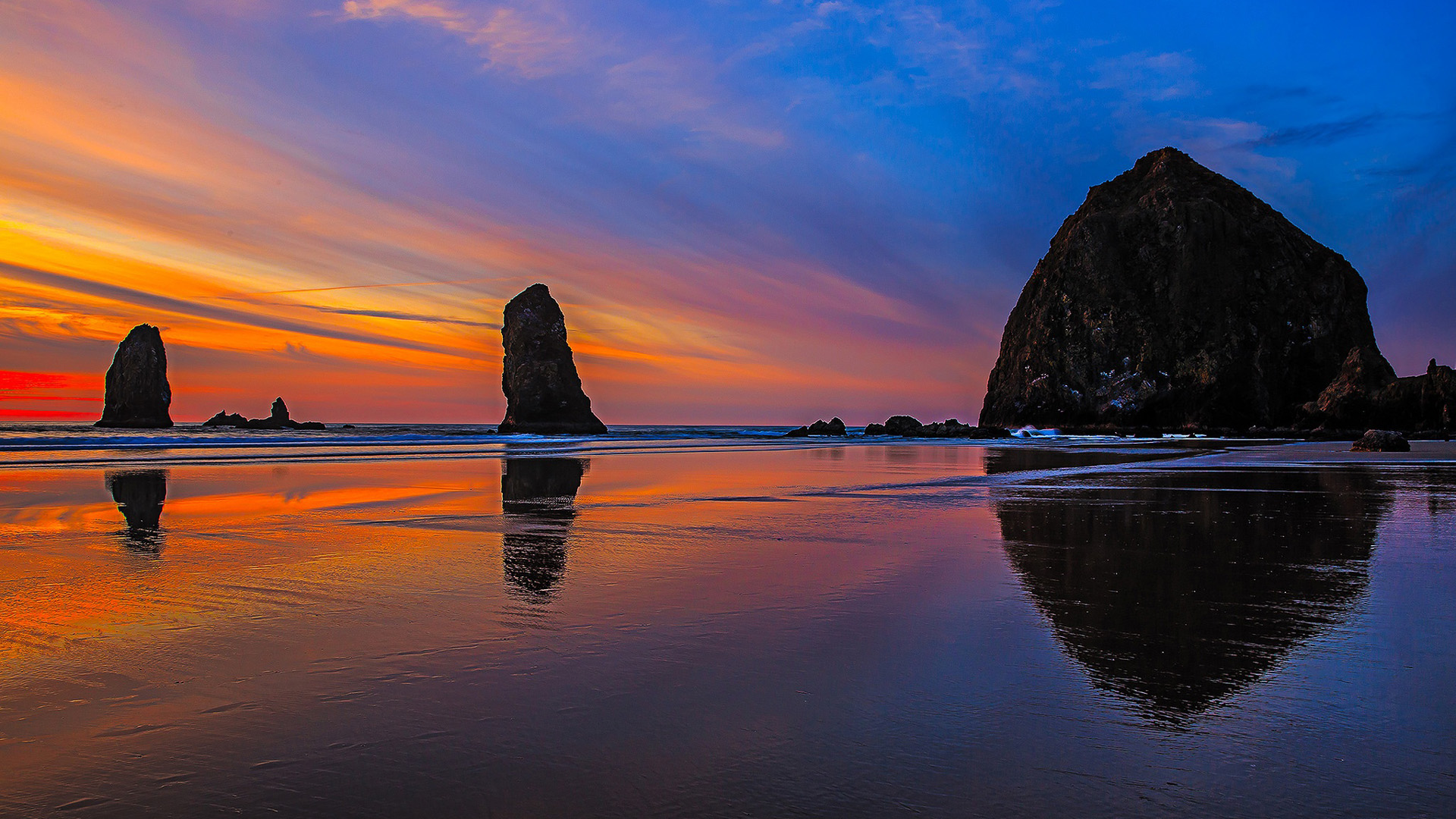 Rocks On Ocean Waves Beach Sand Under Blue Sky During Sunset 2K Sunset