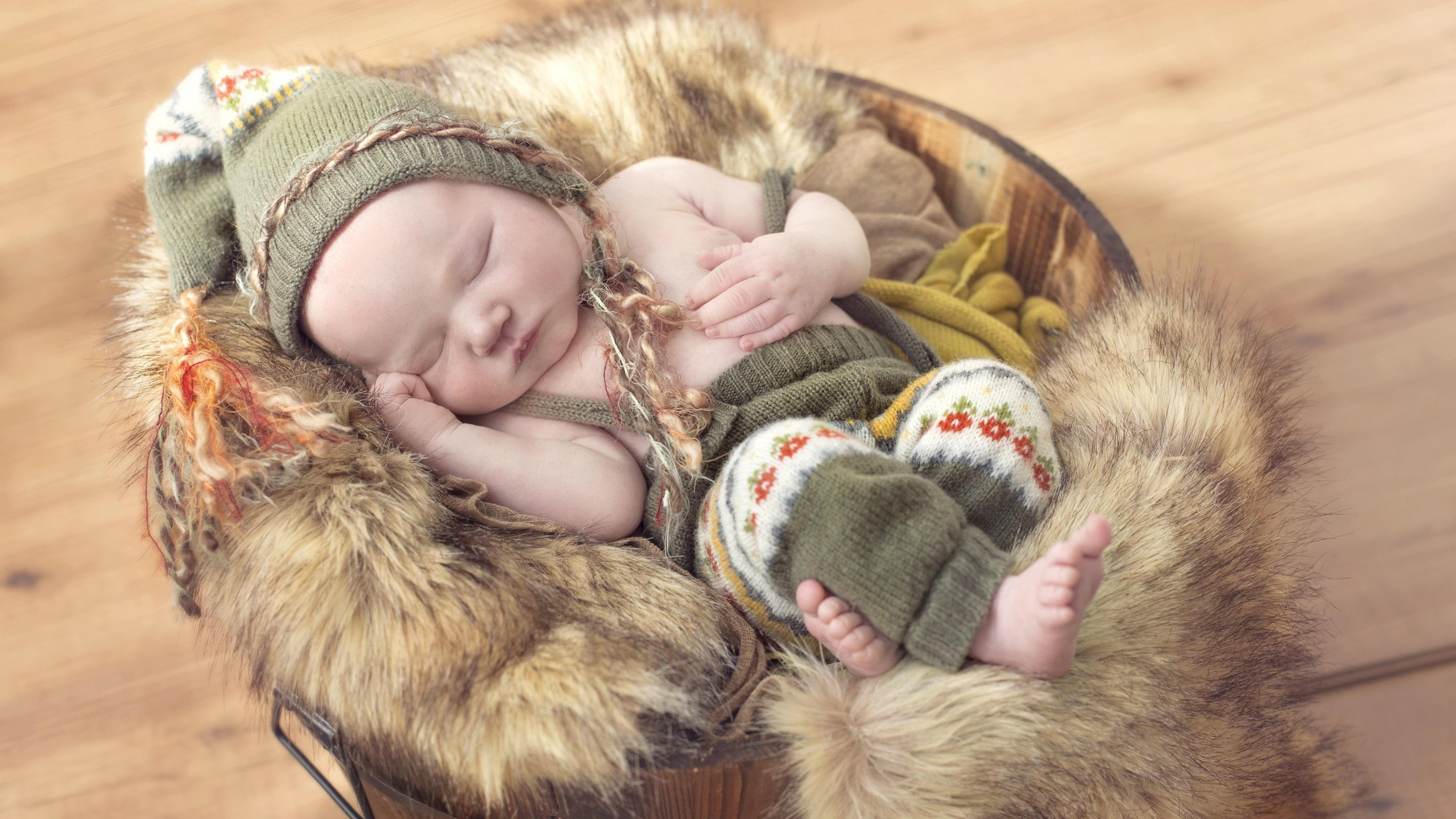 Cute Baby Is Sleeping On Fur Cloth Wearing Woolen Material Dress 2K Cute